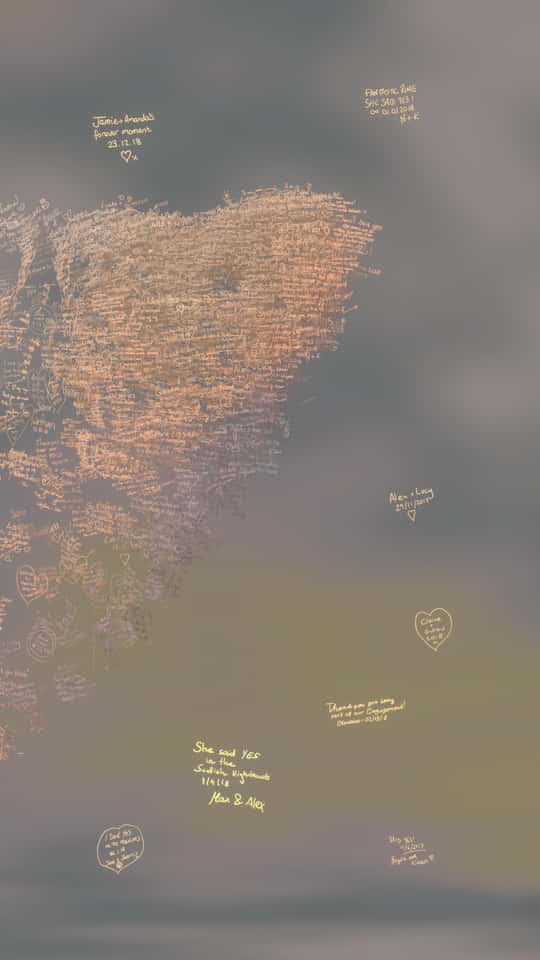 Still of the VASHI Love Wall installation showing a colorful cloud of animated particles forming hand-drawn shapes and messages.