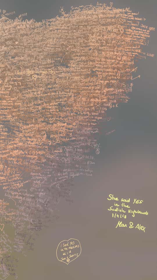 Still of the VASHI Love Wall installation showing a colorful cloud of animated particles forming hand-drawn shapes and messages.